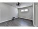 Finished basement features sleek wood floors, recessed lighting and a modern ceiling fan, offering a versatile space at 1043 Harvest Park Ln, Suwanee, GA 30024