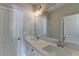 Bright bathroom with double vanity, modern fixtures, and large mirrors offers a clean, contemporary design at 1043 Harvest Park Ln, Suwanee, GA 30024