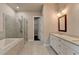 Luxurious bathroom with double vanities, walk-in shower, and a soaking tub at 1043 Harvest Park Ln, Suwanee, GA 30024