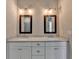 Luxurious bathroom with double vanities and decorative lighting at 1043 Harvest Park Ln, Suwanee, GA 30024