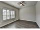 Bedroom with hard wood floors, ceiling fan, and window at 1043 Harvest Park Ln, Suwanee, GA 30024