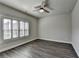 Bedroom with hard wood floors, ceiling fan, and window at 1043 Harvest Park Ln, Suwanee, GA 30024