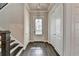 Bright entryway with hardwood floors, closet and a front door with shuttered window at 1043 Harvest Park Ln, Suwanee, GA 30024