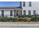 Exterior of a white home with black fence and landscaping at 1043 Harvest Park Ln, Suwanee, GA 30024