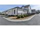 White new construction home with fence, landscaping, and two-car garage at 1043 Harvest Park Ln, Suwanee, GA 30024