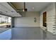 Spacious garage with epoxy flooring, built-in shelving, and an automatic door opener at 1043 Harvest Park Ln, Suwanee, GA 30024