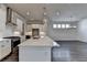 Modern kitchen featuring a large island, stainless steel appliances, and an open floor plan at 1043 Harvest Park Ln, Suwanee, GA 30024