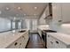 Modern kitchen showcasing white cabinetry, subway tile backsplash, and stainless steel appliances at 1043 Harvest Park Ln, Suwanee, GA 30024