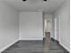 Bright living room offers neutral walls, white trim, and hardwood flooring throughout at 1043 Harvest Park Ln, Suwanee, GA 30024