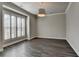 Bright, neutrally painted room with shuttered windows and hardwood flooring at 1043 Harvest Park Ln, Suwanee, GA 30024