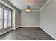 Cozy room with shuttered windows, crown molding and modern light fixture at 1043 Harvest Park Ln, Suwanee, GA 30024