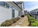 Sideyard of a new home with walkway, fence, and landscaping at 1043 Harvest Park Ln, Suwanee, GA 30024