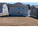 Backyard with large lawn and views of neighborhood at 113 Hampton Ter, Dallas, GA 30157