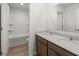 Bright bathroom showcases double granite countertop vanities and a shower with a tub at 113 Hampton Ter, Dallas, GA 30157