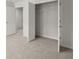 Bedroom with open closet, neutral carpet and view to hallway at 113 Hampton Ter, Dallas, GA 30157