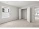 Bedroom features carpeted flooring, a window, and an open closet at 113 Hampton Ter, Dallas, GA 30157