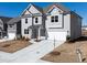 Beautiful exterior showcasing a modern two-story home with a two-car garage, complemented by a well-manicured lawn at 113 Hampton Ter, Dallas, GA 30157