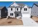 Charming two-story home featuring a welcoming entrance and a two-car garage, nestled in a serene neighborhood at 113 Hampton Ter, Dallas, GA 30157