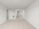 Long hallway featuring neutral carpet and multiple doorways at 113 Hampton Ter, Dallas, GA 30157