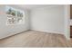 Bright living room with large windows and luxury vinyl plank flooring, providing ample natural light and a modern feel at 113 Hampton Ter, Dallas, GA 30157