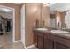 Tastefully designed bathroom features and sinks with granite countertops, and dark cabinets at 1152 Werre Way, Locust Grove, GA 30248