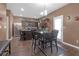 Inviting dining area adjacent to the kitchen with a dark wood table and seating for four at 1152 Werre Way, Locust Grove, GA 30248