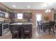 Spacious kitchen with granite countertops, stainless steel appliances, and dark wood cabinetry at 1152 Werre Way, Locust Grove, GA 30248