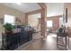 An office space leading into the living room with hardwood floors and neutral paint at 1152 Werre Way, Locust Grove, GA 30248
