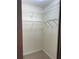 Walk-in closet with carpet and open shelving, providing ample storage space at 118 Hawkstone Way, Alpharetta, GA 30022