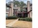 Inviting condo complex with well-manicured landscaping and classic architectural details at 118 Hawkstone Way, Alpharetta, GA 30022