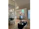 Living room featuring an open floor plan with plenty of light and views of the dining area at 118 Hawkstone Way, Alpharetta, GA 30022