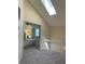 Open loft space offering a flexible area, with a view of a bedroom and skylight at 118 Hawkstone Way, Alpharetta, GA 30022
