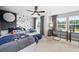Charming bedroom featuring two twin beds, a ceiling fan, and a decorative star wall at 1654 Tide Mill Rd, Cumming, GA 30040