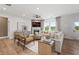 Bright and spacious living room with hardwood floors, stylish furniture, and natural light at 1654 Tide Mill Rd, Cumming, GA 30040