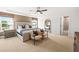 Spacious main bedroom with a luxurious bed, accent chairs, and plenty of natural light at 1654 Tide Mill Rd, Cumming, GA 30040