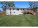 Large, well-manicured backyard with deck and stairs leading up to a two-story home at 2117 Brannen Se Rd, Atlanta, GA 30316