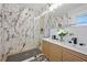 Modern bathroom showcasing a double vanity, marble tile shower, and contemporary fixtures for a luxurious feel at 2117 Brannen Se Rd, Atlanta, GA 30316