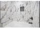 Stylish bathroom featuring a soaking tub with designer tile surround and black fixtures at 2117 Brannen Se Rd, Atlanta, GA 30316