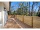 Spacious wood deck with modern horizontal wood railing and a view of the wooded backyard at 2117 Brannen Se Rd, Atlanta, GA 30316