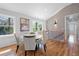 Bright dining area featuring a modern table set, hardwood floors, and contemporary decor with artistic wall design at 2117 Brannen Se Rd, Atlanta, GA 30316