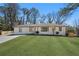Charming renovated ranch-style home featuring a well-manicured lawn and fresh exterior paint at 2117 Brannen Se Rd, Atlanta, GA 30316