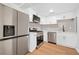 Modern kitchen with stainless steel appliances, white cabinets, and stylish backsplash at 2117 Brannen Se Rd, Atlanta, GA 30316