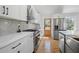 Beautiful kitchen with white cabinets, quartz countertops, and a stainless steel refrigerator at 2117 Brannen Se Rd, Atlanta, GA 30316