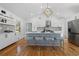 Modern kitchen features white cabinets, stainless steel appliances, kitchen island and sleek counter stools at 2117 Brannen Se Rd, Atlanta, GA 30316