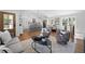 Open-concept living area with hardwood floors, modern decor, and a kitchen island with bar seating at 2117 Brannen Se Rd, Atlanta, GA 30316
