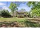 Expansive backyard with a deck, patio, and lush green lawn at 3595 Evonvale Overlook, Cumming, GA 30041
