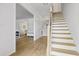Inviting foyer with hardwood floors and staircase leading to the upper level at 3595 Evonvale Overlook, Cumming, GA 30041