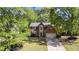Charming two-story brick home with well-maintained landscaping and mature trees at 3595 Evonvale Overlook, Cumming, GA 30041