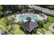 Beautiful community swimming pool with lounge area, gazebo, and lush landscaping offers a perfect leisure retreat at 3595 Evonvale Overlook, Cumming, GA 30041