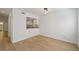 Open dining area with hardwood floors and a passthrough to the modern kitchen at 510 Northridge Crossing Dr, Sandy Springs, GA 30350